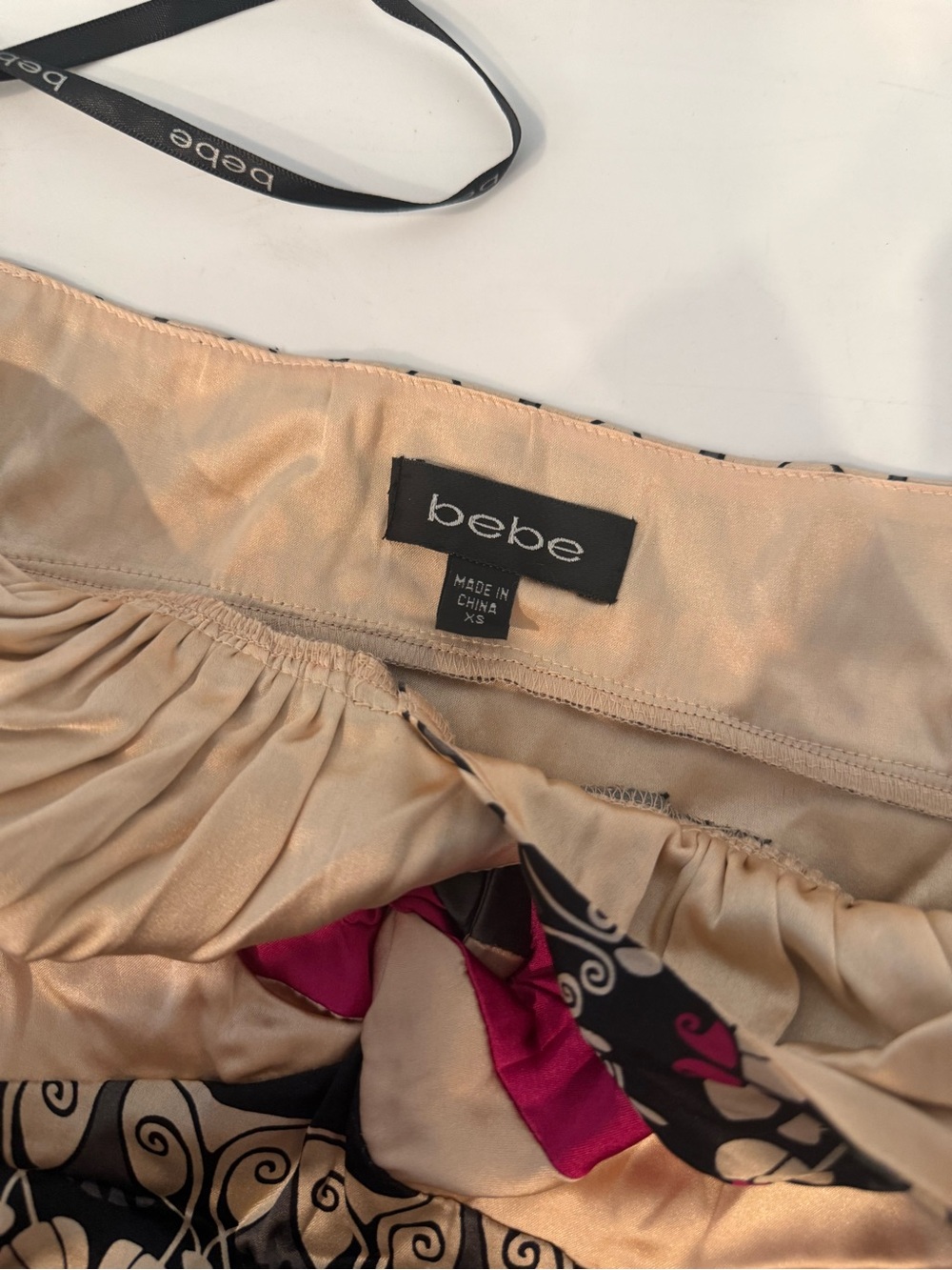 bebe Y2K Black and Cream Patterned Halter Top with Pink Accents - Picture 3 of 3